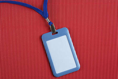 Blank badge on red background, top view. Mockup for designの写真素材