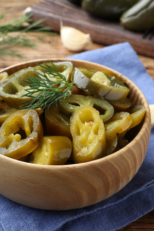 Bowl with slices of pickled green jalapeno peppers on table, closeupの写真素材