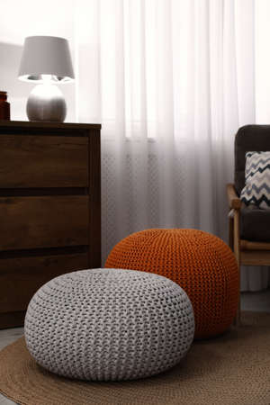Stylish comfortable poufs in room. Home designの写真素材