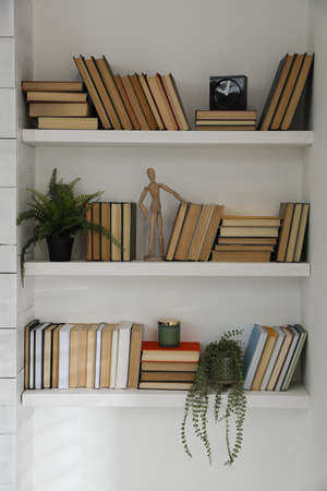 Many shelves with different decor in the room. interior designの写真素材
