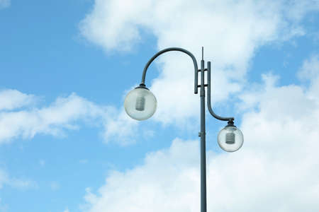 Beautiful street lamp with glass globes outdoors on sunny day. Space for textの写真素材