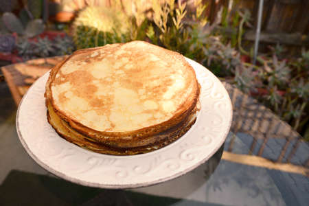 Plate of delicious crepes on black table outdoors, closeupの写真素材