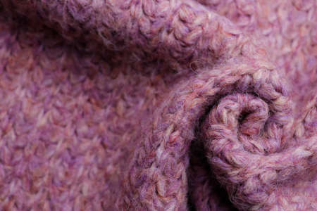 Closeup of violet knitted fabric as background, above view