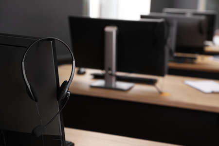 Modern computer with headset in office. hotline serviceの写真素材
