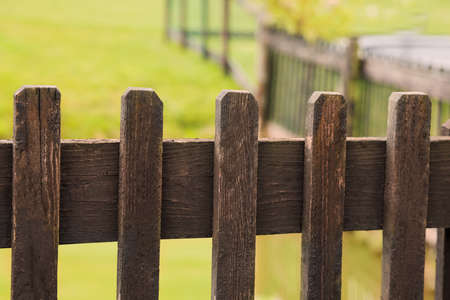 Old wooden fence in park, closeup viewの写真素材