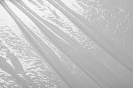 Close up view of transparent plastic stretch wrap film as backgroundの写真素材