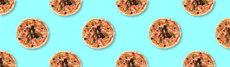 Many delicious seafood pizzas on turquoise background, flat lay. Seamless pattern designの写真素材
