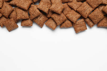 Sweet crispy chocolate corn pads on white background, top view. Space for textの写真素材