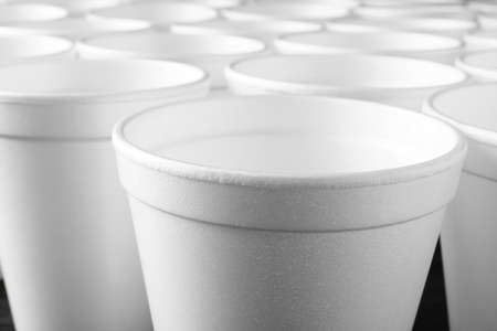 Closeup view of many white styrofoam cupsの写真素材