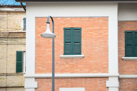 Street lamp near building outdoors on spring day