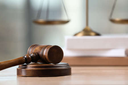 Wooden gavel on table indoors. Space for text