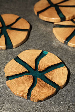 Stylish wooden cup coasters on gray tableの写真素材