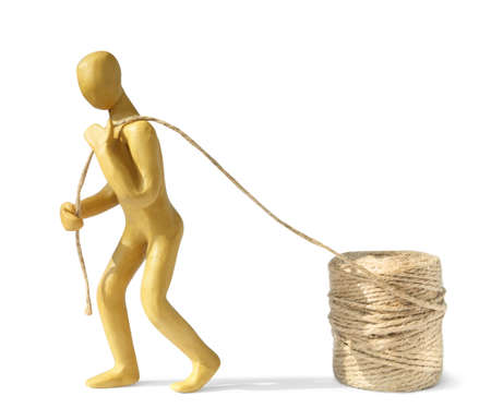 Human figure made of yellow plastic carrying rope isolated on whiteの写真素材