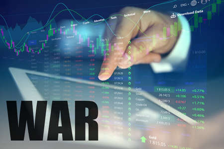 Influence of war on stock exchange. Man using tablet and illustration of rating graph