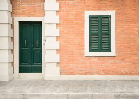 Beautiful building with wooden door on city streetの写真素材