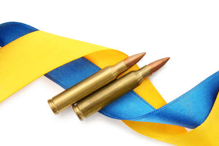 Ribbons in colors of national Ukrainian flag and bullets on white background, top viewの写真素材