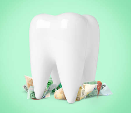 Model of tooth and euro banknotes on turquoise background. Concept of expensive dental procedures