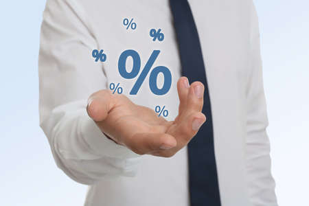 Man showing virtual percent sign on white background, closeup. discount conceptの写真素材