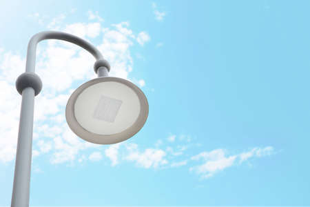Street lamp against sky, low angle view. Space for text