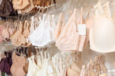 Many different beautiful women's underwear in lingerie store, closeupの写真素材