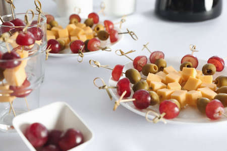 Delicious snacks on white table. coffee break