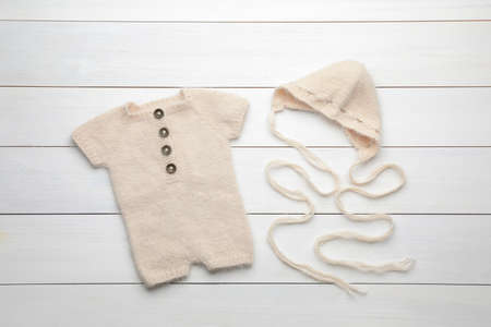 Stylish child's clothes on white wooden table, flat layの写真素材