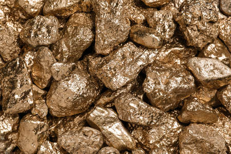 Many gold nuggets as background, top view
