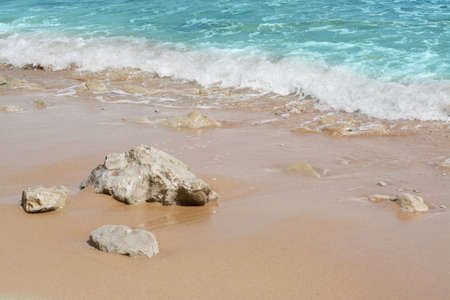 Beautiful view of sandy beach with rocks and sea. summer holidaysの写真素材