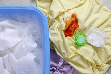 Dirty garment and detergent near basin with white shirt, top view. hand washing laundryの写真素材