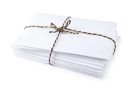 Stack of letters wrapped with rope on white backgroundの写真素材