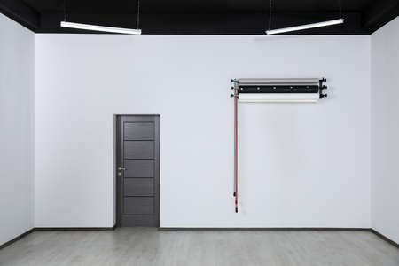 Colorful photo background rolls near door in office. interior design