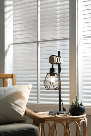 Room interior with stylish lamp and furnitureの写真素材