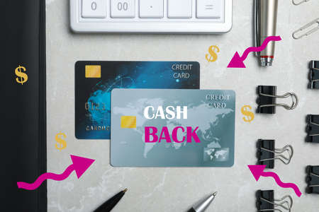 Flat lay composition with cashback credit cards, calculator and stationery on light gray marble backgroundの写真素材