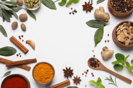 Different herbs and spices on white background, top viewの写真素材