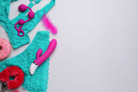 Sex toys and lingerie on white background, flat lay. Space for textの写真素材