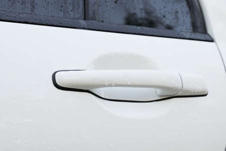 Close up view of car door handle with water dropsの写真素材