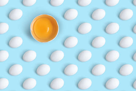 Group of chicken eggs on light blue background, flat lay. Seamless pattern design