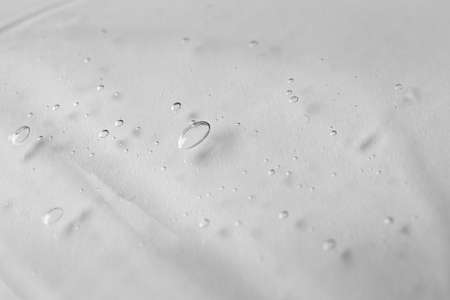 Texture of transparent shower gel on white background, closeupの写真素材