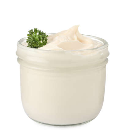Mayonnaise with parsley in glass jar isolated on whiteの写真素材