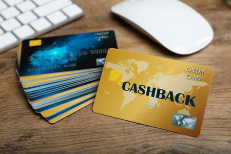 Cashback and credit cards on wooden table, closeup viewの写真素材