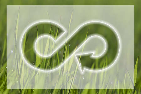 Circular economy concept. Green grass and illustration of infinity symbol