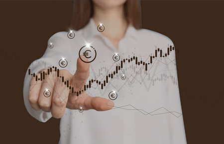 Woman pointing at virtual euro sign on brown background, closeupの写真素材