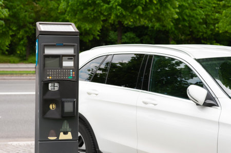 Parking meter near car on city street