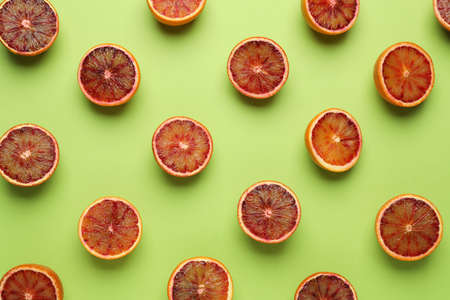 Many ripe sicilian oranges on light green background, flat layの写真素材