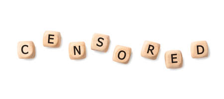Wooden cubes with word Censored on white background, top view