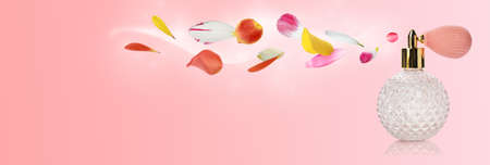 Perfume bottle with floral scent on pale pink background, banner designの写真素材