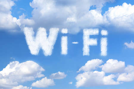 Clouds in shape of word WI-FI against blue skyの写真素材