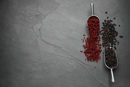 Dried red and black currant berries on dark table, flat lay. Space for textの写真素材