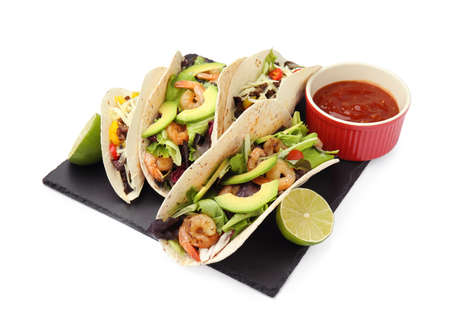 Delicious tacos, lime and sauce on white backgroundの写真素材