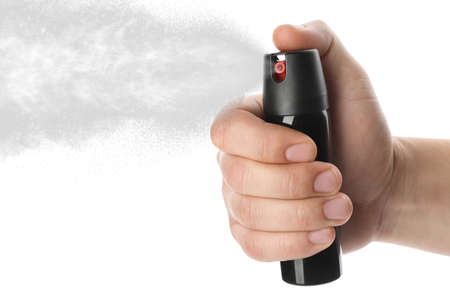 Man using pepper spray on white background, closeupの写真素材